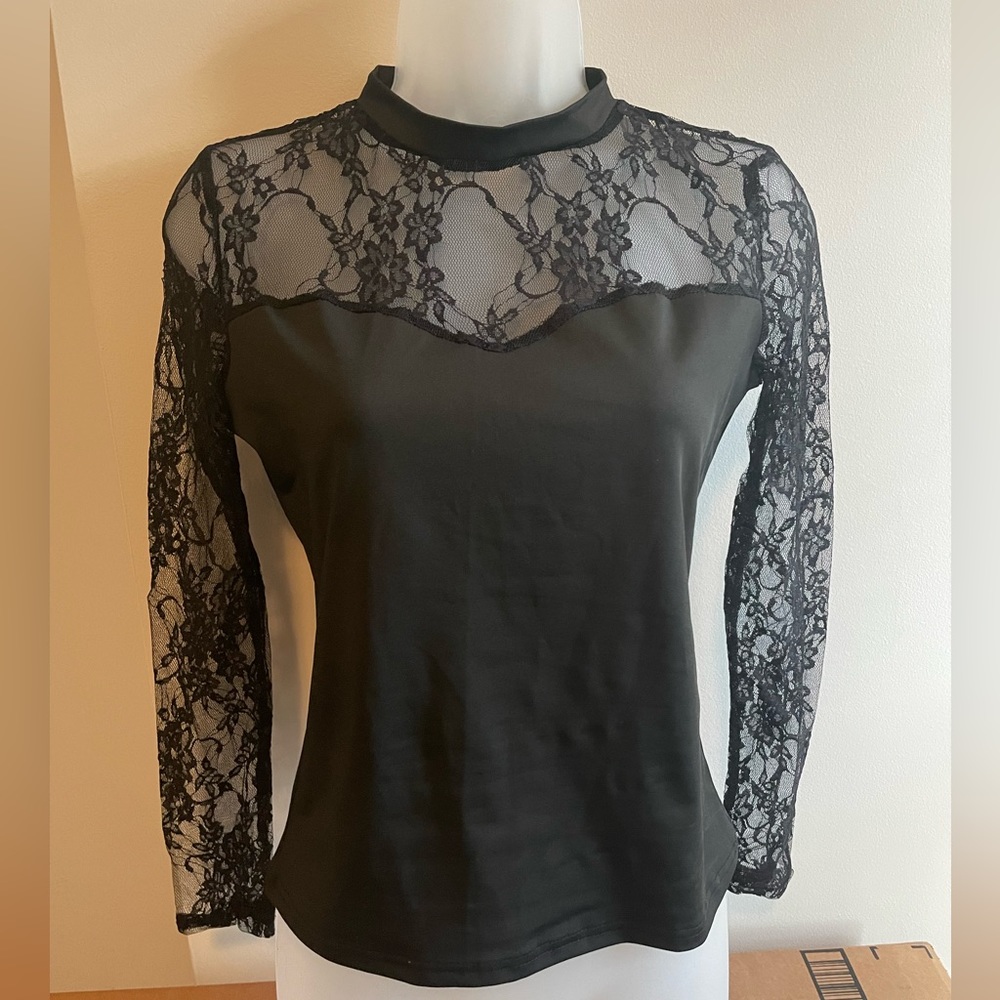 Sexy, form fitting black lace top.